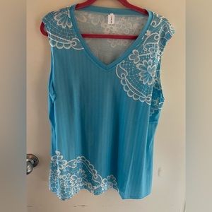 Pretty sleeveless women’s top with floral design. Very lightweight